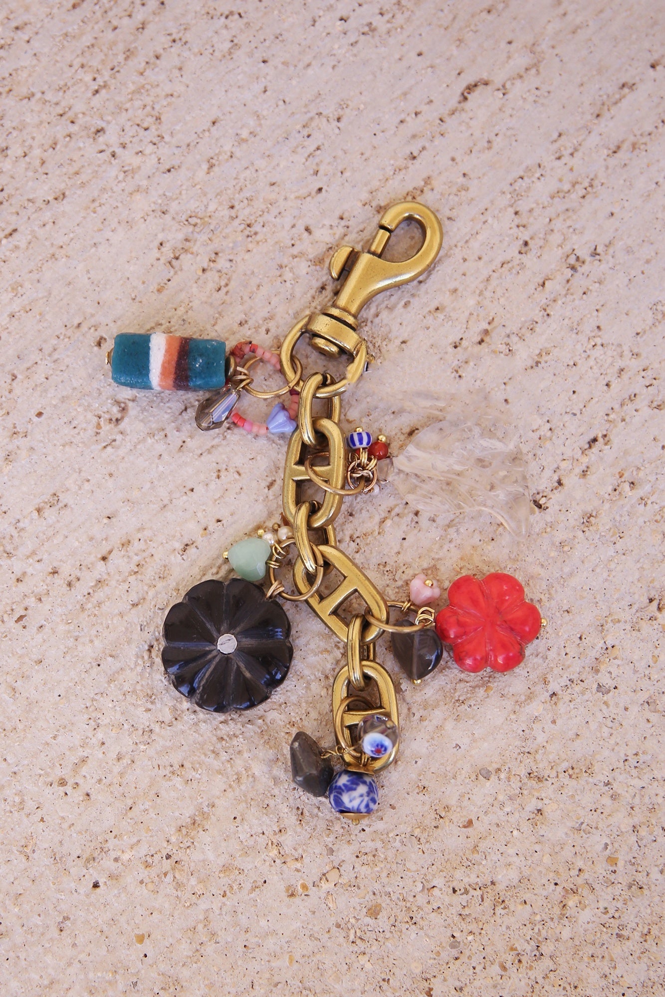 Brass Bag Charm w/ Quartz Leaf, Red Magnesite Flower, Horn Flower, Jade Heart, Czech Glass, + Ghanaian Sandcast Bead