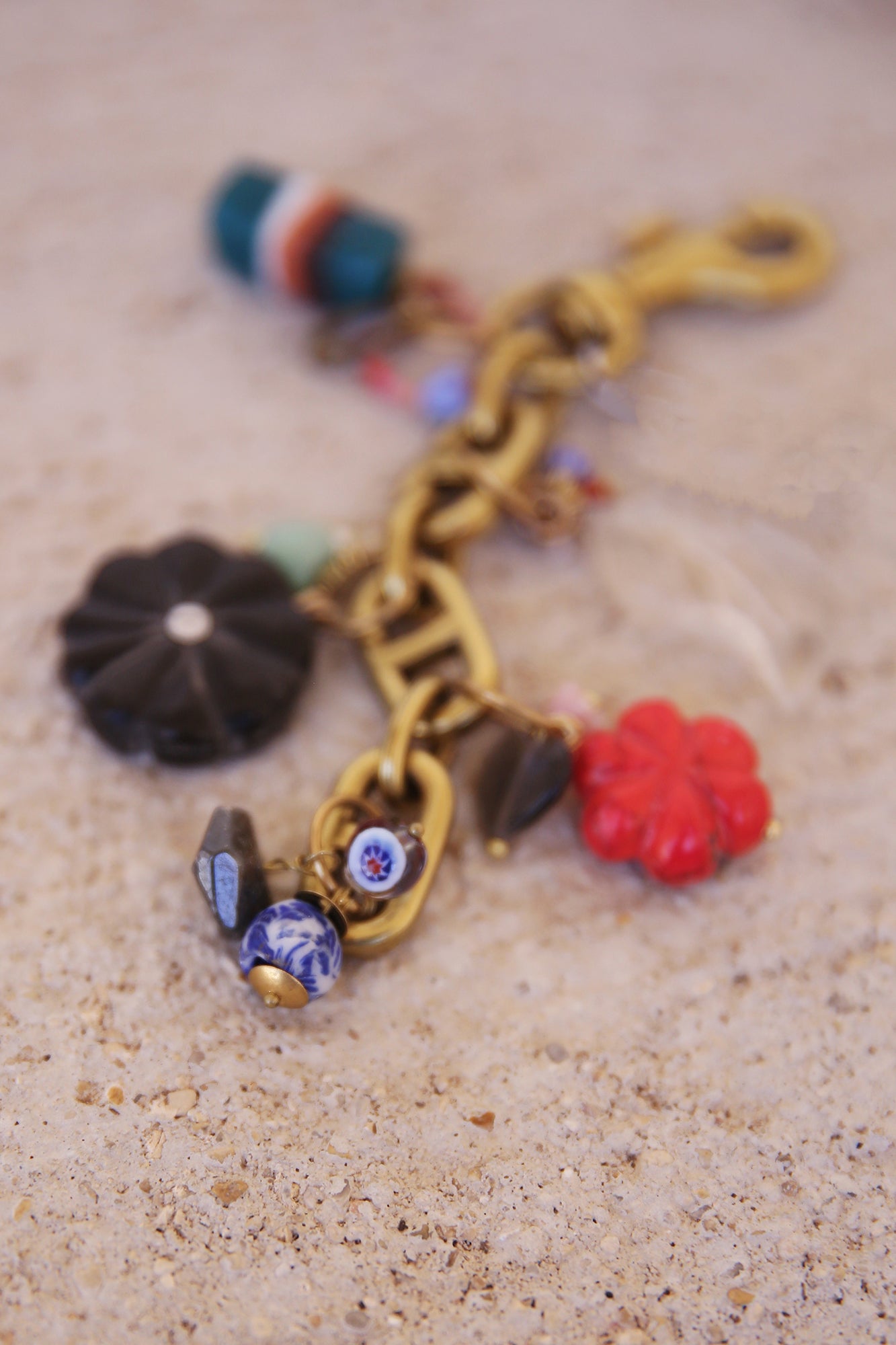 Brass Bag Charm w/ Quartz Leaf, Red Magnesite Flower, Horn Flower, Jade Heart, Czech Glass, + Ghanaian Sandcast Bead